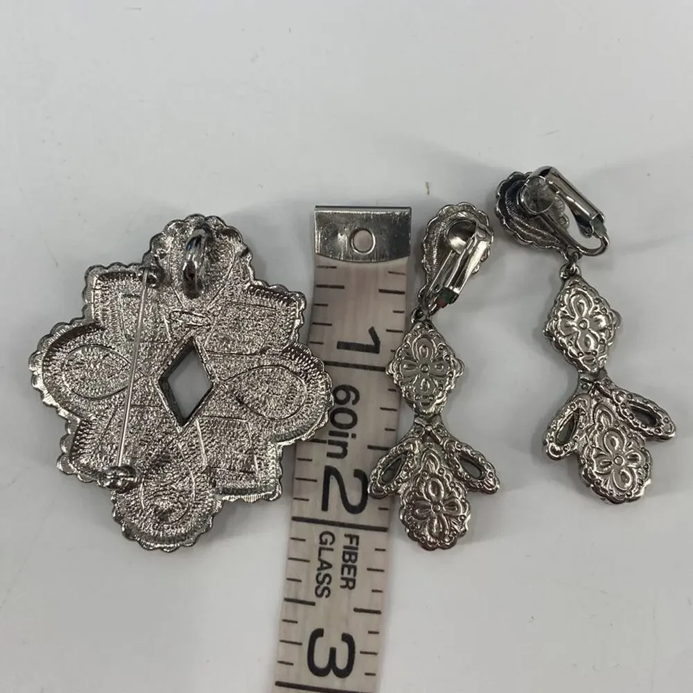 Avon tribal clip on earrings and brooch set